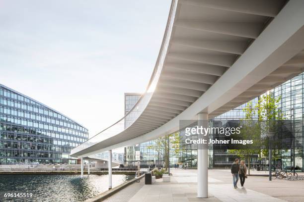elevated passage and modern buildings - copenhagen foto e immagini stock
