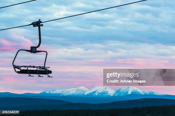chairlift with mountain landscape in background - ski lift stock pictures, royalty-free photos & images