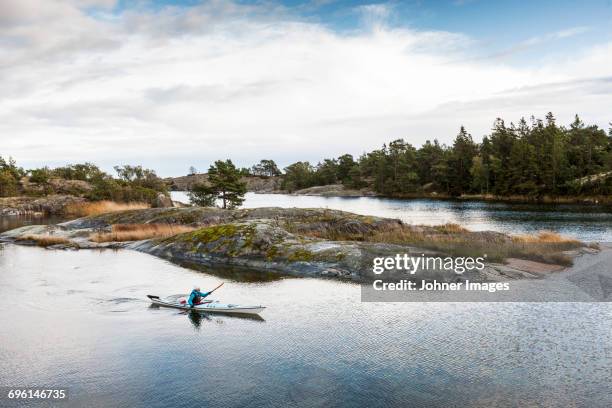 person kayaking on sea - stockholm archipelago stock pictures, royalty-free photos & images