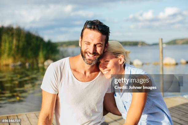 young couple together - couple jetty stock pictures, royalty-free photos & images