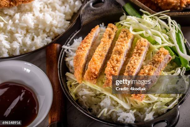 panko crusted crispy pork cutlets over steamed rice - tonkatsu stock pictures, royalty-free photos & images