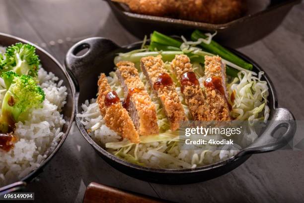 panko crusted crispy pork cutlets over steamed rice - tonkatsu stock pictures, royalty-free photos & images