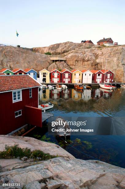 wooden fishing huts on rocky coast - göteborg stock pictures, royalty-free photos & images