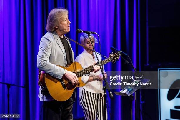 Justin Hayward and Julie Ragins perform during An Evening With Justin Hayward at The GRAMMY Museum on June 14, 2017 in Los Angeles, California.