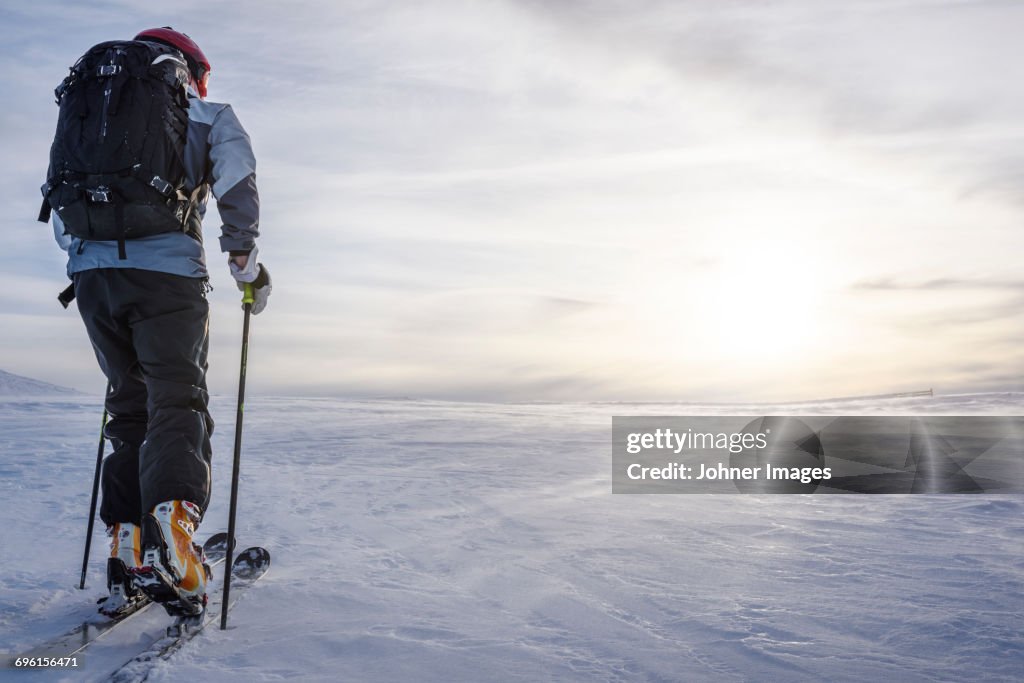 Skier skiing at sunny day