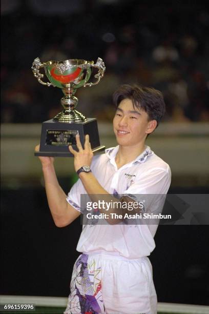 Takao Suzuki celebrates with the trophy after winning the Men's Singles after beating Kotaro Miyaji in the final during the 31st All Japan Indoor...