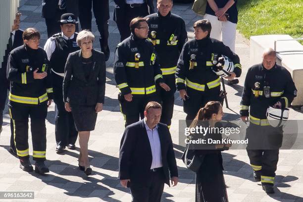 Prime Minister Theresa May speaks to Dany Cotton, Commissioner of the London Fire Brigade, with members of the fire service as she visits Grenfell...