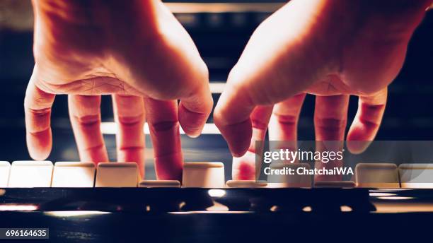 close-up of a woman's hands playing the piano - pianist woman stock pictures, royalty-free photos & images