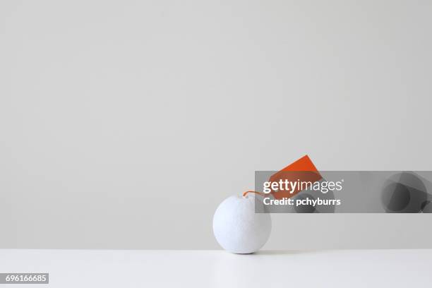 white painted orange with orange tag - pchyburrs stock pictures, royalty-free photos & images