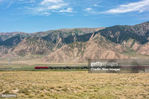 train and range of mountains - qinghai province stock pictures, royalty-free photos & images