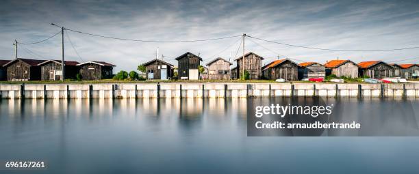 wooden huts along seafront, gujan-mestras, gironde, france - arcachon stock pictures, royalty-free photos & images