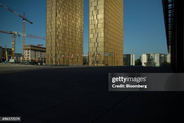 Construction cranes stand beside the European Union Court of Justice buildings in the Plateau de Kirchberg district of Luxembourg, on Wednesday, June...