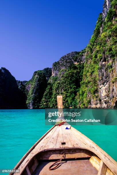 boat and karst cliffs - phi phi islands stock pictures, royalty-free photos & images