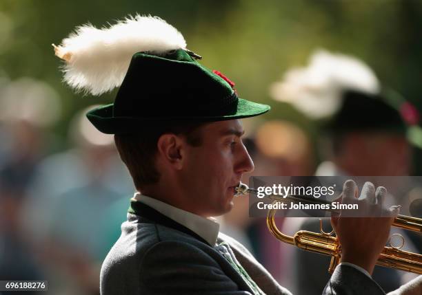 Participants dressed in traditional Bavarian folk outfitsarrive for to board boats to cross Staffelsee Lake in the annual Corpus Christi procession...