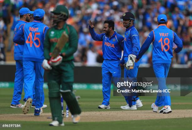 Kedar Jadhav of India celebrates bowling Tamim Iqbal of Bangladesh during the ICC Champions Trophy Semi Final match between Bangladesh and India at...