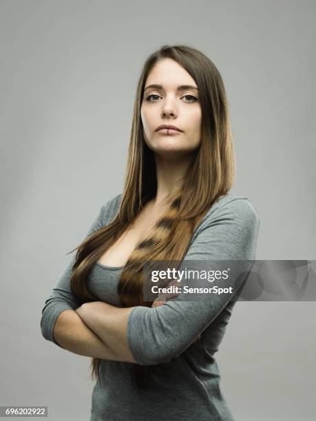 real young woman studio portrait - tough girl attitude stock pictures, royalty-free photos & images