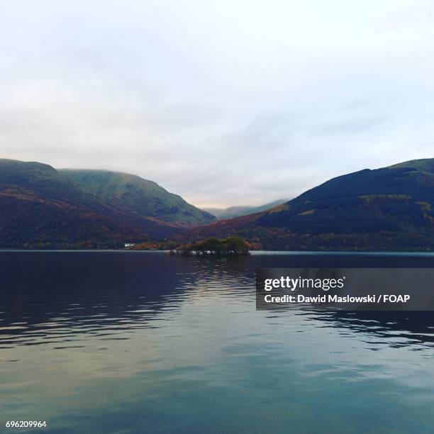 mountain reflecting in lake - maslowski stock pictures, royalty-free photos & images