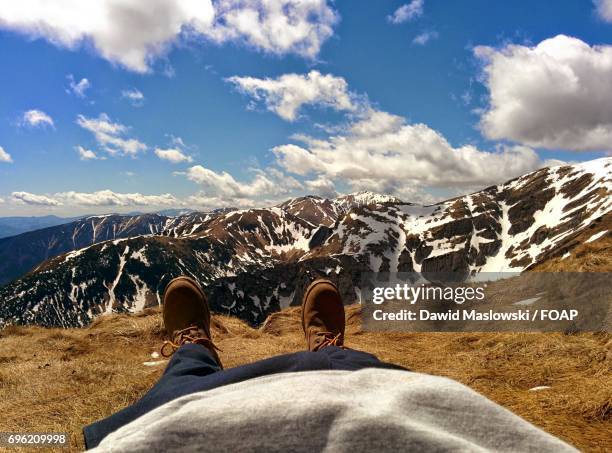 a person relaxing on mountain - maslowski stock pictures, royalty-free photos & images