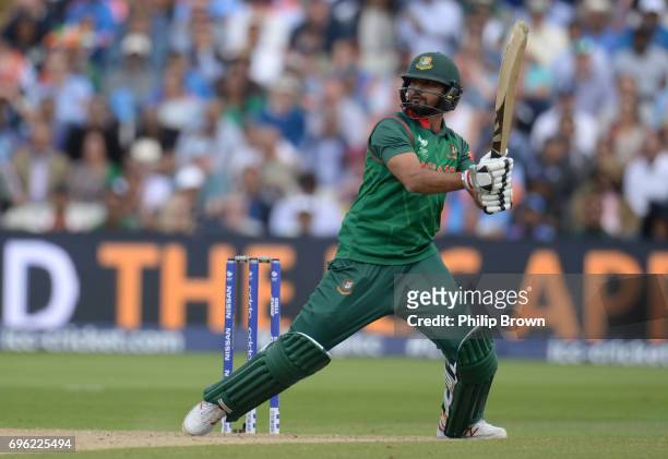 Mashrafe Mortaza of Bangladesh hits a four during the ICC Champions Trophy match between Bangladesh and India at Edgbaston cricket ground on June 15,...