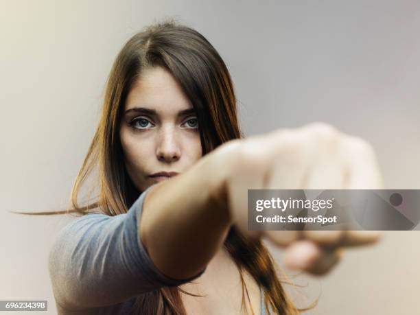 real woman ready for fight - fist punch stock pictures, royalty-free photos & images