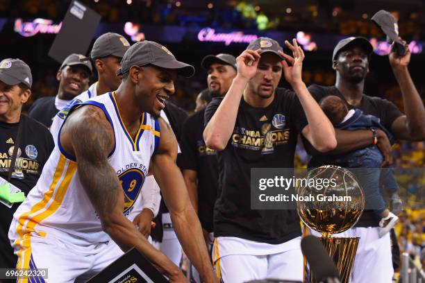 Andre Iguodala and Klay Thompson of the Golden State Warriors celebrate with the Larry O'Brien Trohpy after winning Game Five of the 2017 NBA Finals...