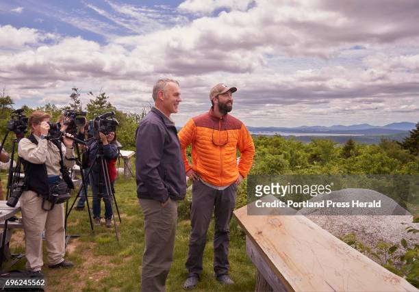 Interior Secretary Ryan Zinke, left, and Lucas St. Clair look out over the Katahdin Woods & Waters National Monument while on a tour of the monument...