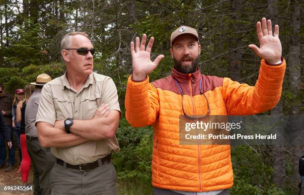 Lucas St. Clair, right, whose family donated the land for the Katahdin Woods & Waters National Monument, talks with Interior Secretary Ryan Zinke...