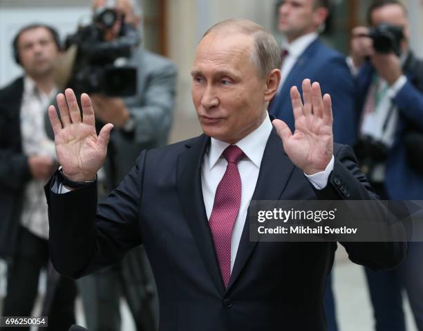 Russian President Vladimir Putin attends a press conference during his annual call-in-show at press center in Gostiny dvor June 15, 2017 in Moscow,...