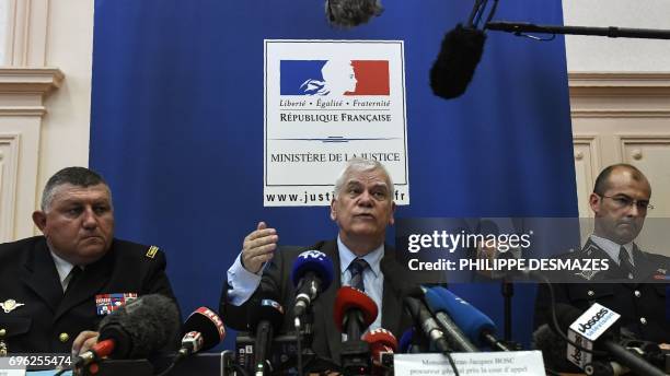 Dijon's general prosecutor Jean-Jacques Bosc gives a press conference next to General gendarme Olivier Kim and Colonel Dominique Lambert in Dijon, on...