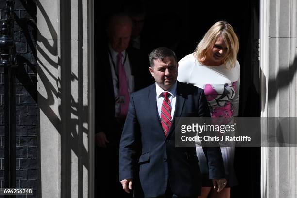 Robin Swann, Leader of the Ulster Unionist Party, walks with colleagues as he prepares to speak to the media outside 10 Downing Street on June 15,...