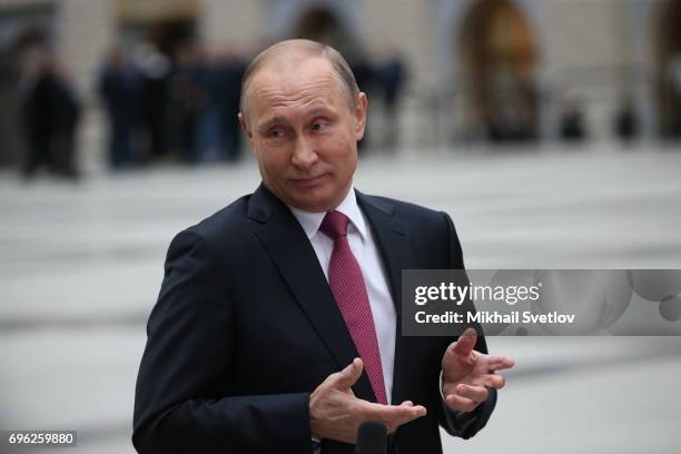 Russian President Vladimir Putin attends a press conference during his annual call-in-show at press center in Gostiny dvor June 15, 2017 in Moscow,...