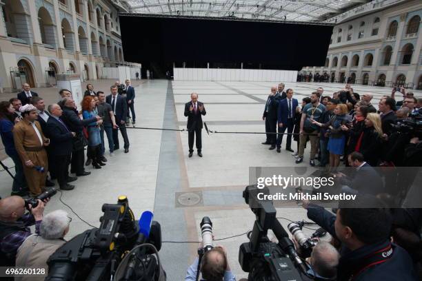 Russian President Vladimir Putin attends a press conference during his annual call-in-show at press center in Gostiny dvor June 15, 2017 in Moscow,...