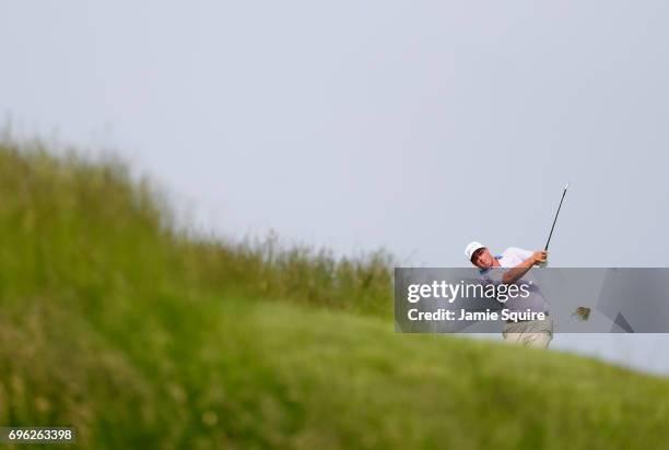 Michael Putnam of the United States plays his shot on the 17th hole during the first round of the 2017 U.S. Open at Erin Hills on June 15, 2017 in...