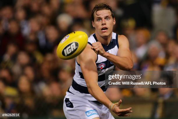 Jake Kolodjashnij of the Cats handpasses the ball during the round 13 AFL match between the West Coast Eagles and the Geelong Cats at Domain Stadium...