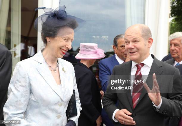 British Princess Anne arrives in Hamburg, northern Germany next to Hamburg's mayor Olaf Scholz on June 15, 2017 to attend a party marking the 91st...
