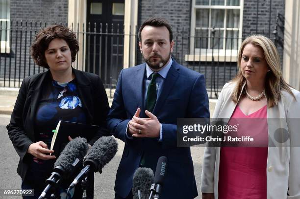 Colum Eastwood, leader of the Social Democratic and Labour Party stands with colleagues as he speaks to the media outside 10 Downing Street on June...