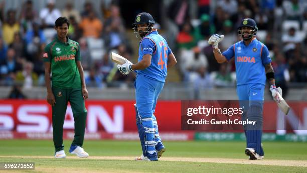 Rohit Sharma of India celebrates with Virat Kohli after reaching his century during the ICC Champions Trophy Semi Final between Bangladesh and India...