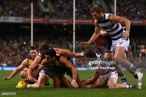 Jake Kolodjashnij of the Cats and Thomas Cole of the Eagles contest for the ball during the round 13 AFL match between the West Coast Eagles and the...