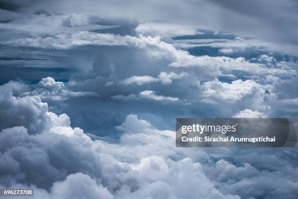 layers of clouds in a moody sky - aircraft point of view stock pictures, royalty-free photos & images