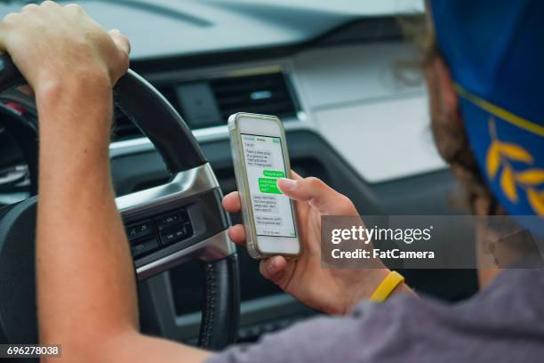 distracted driver - distracted driving stock pictures, royalty-free photos & images