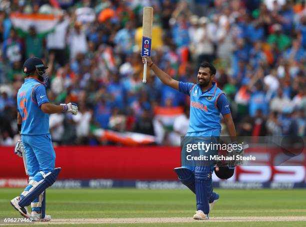 Rohit Sharma of India celebrates reaching his century alongside Virat Kohli during the ICC Champions Trophy Semi-Final match between Bangladesh and...