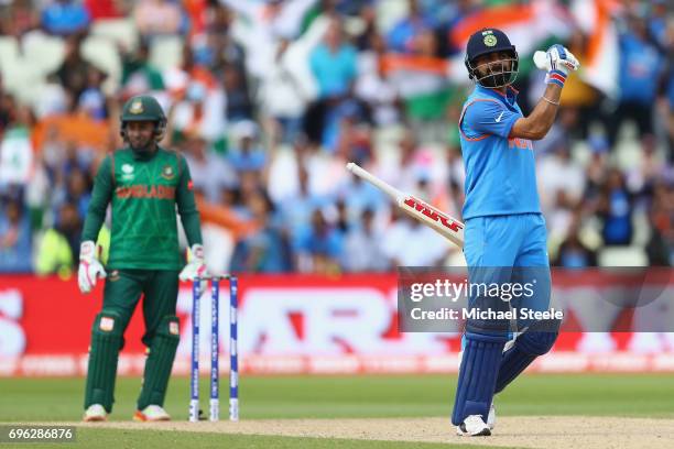 Virat Kohli of India celebrates hitting the winning runs and victory by 9 wickets during the ICC Champions Trophy Semi-Final match between Bangladesh...