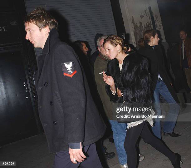 Model Kate Moss and boyfriend Jefferson Hack leave the Marc Jacobs fashion show February 11, 2002 in New York City.