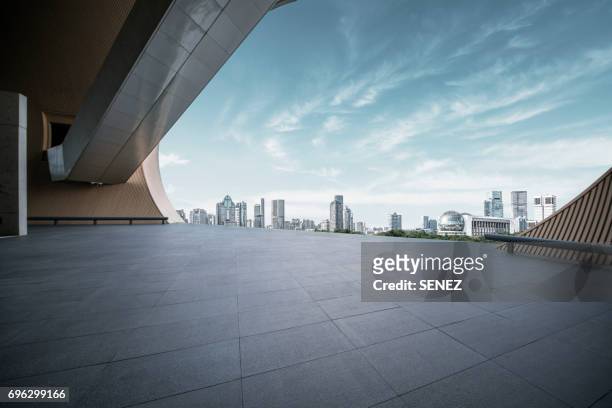 shanghai poly grand theatre and town square - cloudy day office building stockfoto's en -beelden
