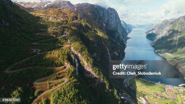 scenic aerial view of lysefjorden and winding road - norway road stock pictures, royalty-free photos & images