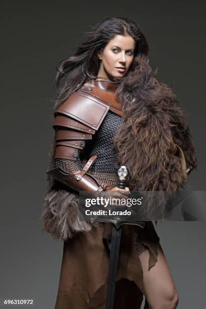 dark haired viking woman in studio setting - cosplayer stock pictures, royalty-free photos & images