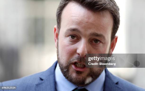 Colum Eastwood, leader of the Social Democratic and Labour Party, speaks to the media outside number 10 Downing Street in London, U.K., on Thursday,...