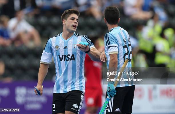 Gonzalo Peillat of Argentina celebrates as he scores their first goal during with Matias Rey of Argentina during the Pool A match between Korea and...