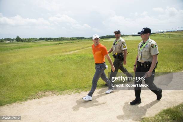 Rory McIlroy walking with security during Wednesday practice at Erin Hills GC. Hartford, WI 6/14/2017 CREDIT: Robert Beck