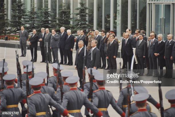 Chancellor of the Federal Republic of Germany Willy Brandt stands on right with Soviet Premier and statesman, Alexei Kosygin as they inspect a march...
